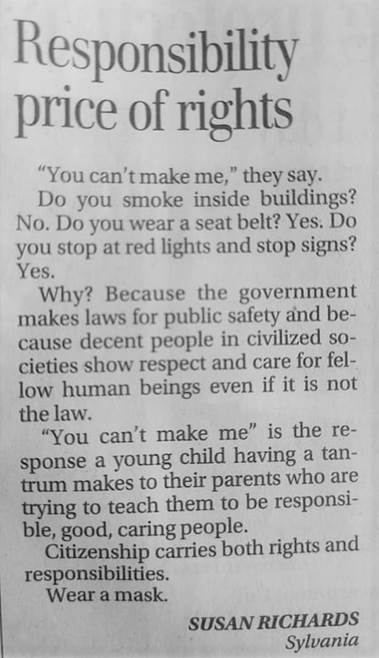 A close up of a newspaper

Description automatically generated